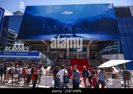 Cannes, France. 22nd May, 2024. An official banner of the 77th annual Cannes Film Festival hanging on Palais des Festivals on May 22, 2024 in Cannes, France. (Credit Image: © Beata Zawrzel/ZUMA Press Wire) EDITORIAL USAGE ONLY! Not for Commercial USAGE! Stock Photo