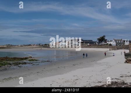 Looking along the impressive popular white sandy beach of Cobo Bay Castel Guernsey Channel Islands on a lovely sunny May day Stock Photo