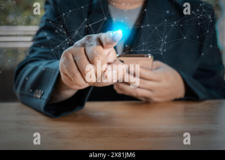 Businessman use finger point to networking and data exchanges customer connection on dark background and use smartphone, touchscreen device connecting Stock Photo