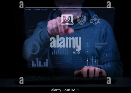 Close-up of a man's hands on a laptop keyboard and virtual screen with business, banking and financial diagrams. Concept of business and financial ind Stock Photo