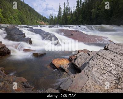 The strong rush of the Yaak Falls in northwest Montana on a spring day. Stock Photo