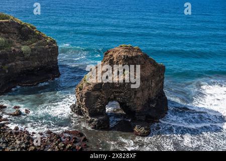 Roque Chico sea arch, an excellent example of coastal erosion by wave action from Rambla de Castro walking path near Puerto de la Cruz, Tenerife Stock Photo