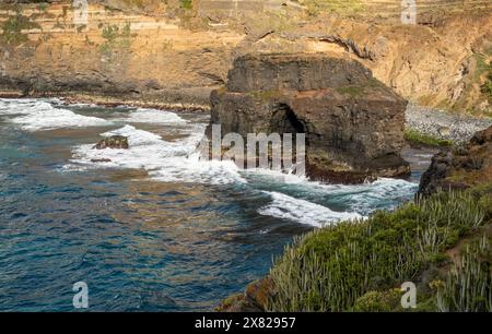 Roque Chico sea arch, an excellent example of coastal erosion by wave action from Rambla de Castro walking path near Puerto de la Cruz, Tenerife Stock Photo