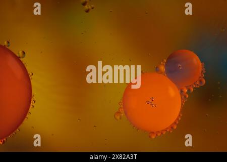 Colorful abstract macro background with oil drops in water Stock Photo