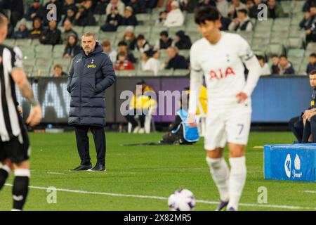 Melbourne, Australia. 22nd May, 2024. Tottenham Hotspur FC Head Coach Ange Postecoglou (C) looks on as Heung-min Son of Tottenham Hotspur FC (R) dribbles the ball during the exhibition match between Tottenham Hotspur FC and Newcastle United FC at the Melbourne Cricket Ground on May 22, 2024 in Melbourne, Australia. Newcastle won the game on penalties 5-4. Newcastle won the game on penalties 5-4. Credit: SOPA Images Limited/Alamy Live News Stock Photo