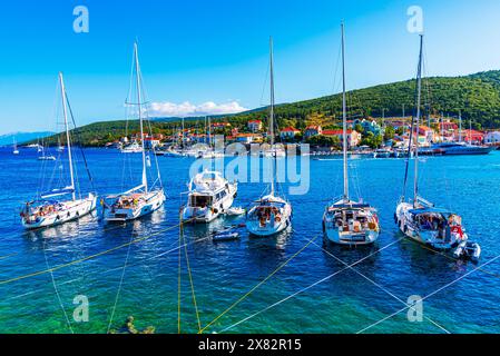 Fiskardo, Kefalonia, Greece: Panoramic view of the Fiskardo bay over the village and the boats ancored, Ionian island, Europe travel destination Stock Photo