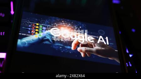 Viersen, Germany - May 9. 2024: Closeup of smartphone with logo lettering of Google AI artificial intelligence  on computer keyboard Stock Photo