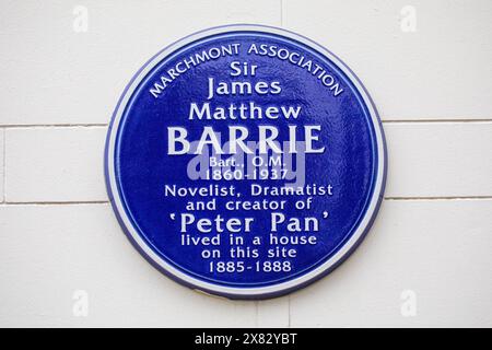 London, UK - February 5th 2024: Blue Plaque on a building on Grenville Street in London, UK, marking where the creator of Peter Pan - Sir James Matthe Stock Photo