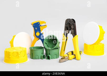 Electrician's tools on light background Stock Photo