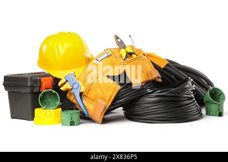 Electrician tools, rolled cables, electrical junction box and socket mounting boxes on white background Stock Photo