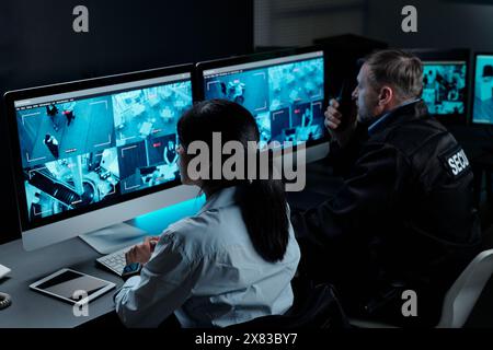 cctv screen. CCTV monitors in control room at Cardiff Central Police ...