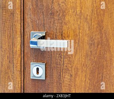 modern metal Door handle and keyhole doorknob Stock Photo - Alamy
