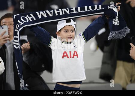 MELBOURNE, AUSTRALIA. 22 May, 2024. Pictured: A young Tottenham Hotspur fan holds up a Tottenham scarf in the stands of Melbourne Cricket Ground during the Global Football Week English Premiership teams friendly at the MCG in Melbourne. Credit: Karl Phillipson/Alamy Live News Stock Photo