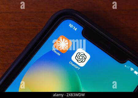 Vancouver, CANADA - May 20 2024 : Claude by Anthropic and ChatGPT (OpenAI) app icons seen in an iPhone screen. Stock Photo