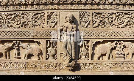 Carving of Women Feeding Milk to Child and Elephants With Garlands, Ahilya Devi Maheshwar Fort, Madhya Pradesh, India. Stock Photo