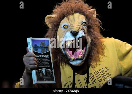 Buenos Aires, Argentina. 22nd May, 2024. A supporter of Argentine President Milei arrives at a stadium for the presentation of his book 'Capitalism, Socialism and the Neoclassical Trap' in Buenos Aires, Argentina. Credit: Cristina Sille/dpa/Alamy Live News Stock Photo