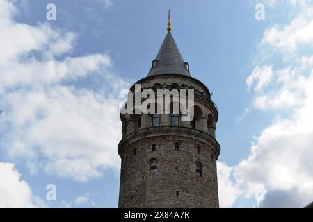 Galata Tower, Galata, Karakoey, Beyoglu, Istanbul, Istanbul Province, Turkey, Asia, Stone historical tower with spire and surrounding clouds in the Stock Photo