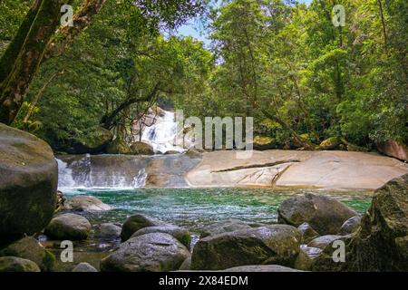 There's a walkway up to the top of Josephine Falls from the rock pool at lower level of this cascading multi-tiered waterfall in Far North Queensland Stock Photo