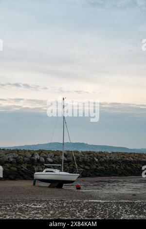 Small boats moored in the harbour at Rhos-on-Sea, Wales, Uk at low tide. Stock Photo