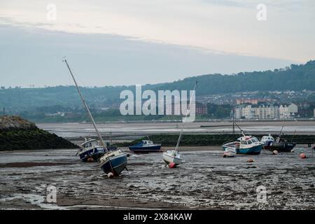 RHOS-ON-SEA, WALES, UNITED KINGDOM - MAY 10 2024: Small boats moored in the harbour at Rhos-on-Sea, Wales, Uk at low tide. Stock Photo
