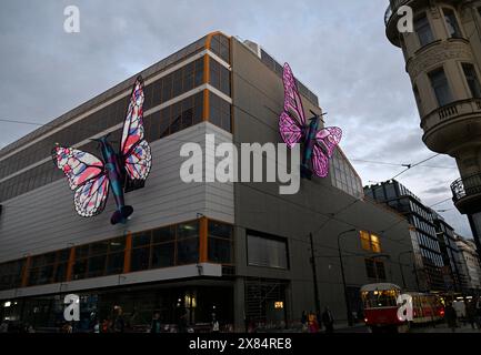 Prague, Czech Republic. 22nd May, 2024. Moving sculptures of butterflies by Czech artist David Cerny on the facade of the Maj department store in Prague, Czech Republic, pictured on May 22, 2024. The butterfly fuselages are imitations of Spitfire fighters, the installation is a tribute to Czechoslovak airmen who fought in World War II. Credit: Michal Krumphanzl/CTK Photo/Alamy Live News Stock Photo