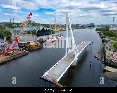 Aerial view from drone of new Govan-Partick Bridge under construction across the River Clyde at the Riverside Museum. The new swing bridge will connec Stock Photo