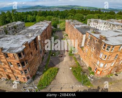 Aerial view from drone of derelict abandoned apartment buildings at Clune Park in Port Glasgow, Inverclyde, Scotland, UK Stock Photo