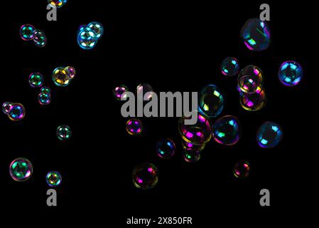 Soap bubbles isolated on a black background Stock Photo