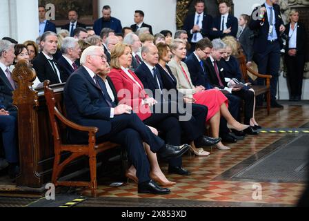 23 May 2024, Berlin: The representatives of the constitutional bodies (l-r), Federal President Frank-Walter Steinmeier and his wife Elke Büdenbender, Bundestag President Bärbel Bas (SPD), Federal Chancellor Olaf Scholz (SPD) and his wife Britta Ernst, Manuela Schwesig (SPD), Minister President of Mecklenburg-Western Pomerania and current President of the Bundesrat, and her husband Stefan Schwesig, as well as Stephan Harbarth, President of the Federal Constitutional Court, and his wife Juliane Harbarth sit at the ecumenical service to mark the 75th anniversary of the Basic Law in St. Mary's Chu Stock Photo