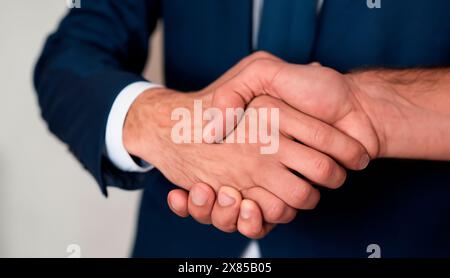 Two men shake hands. Close-up of shaking hands Stock Photo