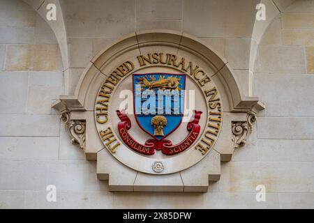 The Chartered Insurance Institute Coat of Arms, logo or sign outside the HQ located at Insurance Hall, 20 Aldermanbury in the City of London. Stock Photo