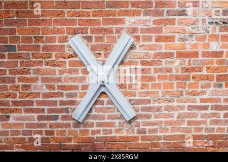 Structural wall brace on red brick wall Stock Photo