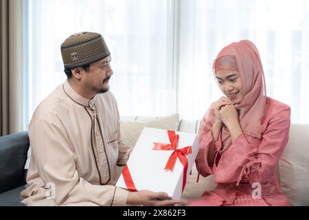 The couple gives gifts to each other Stock Photo