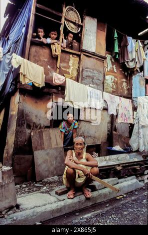 Philippines, Manila; Three generations of a family in a city slum. Stock Photo