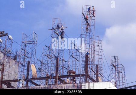 Philippines, Manila, construction workers are building a frame for the construction of more floors on a building under construction. Stock Photo
