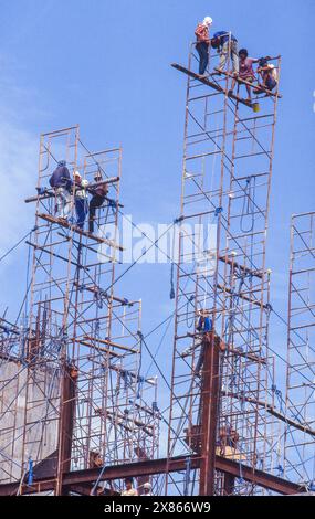 Philippines, Manila, construction workers are building a frame for the construction of more floors on a building under construction. Stock Photo