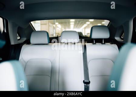 Back passenger seats with armrest electric car. Rear passenger seats. Stock Photo