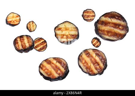 Slices of grilled eggplants in air on white background Stock Photo