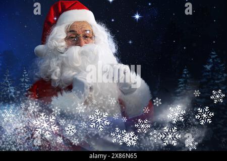 Santa Claus in snowy winter forest. Christmas magic Stock Photo