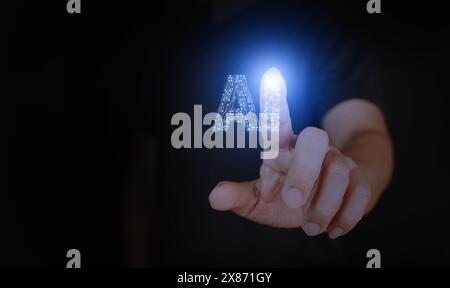 AI, artificial intelligence, a man's hand touching a circuit Ai letters to activate or to use it. Stock Photo