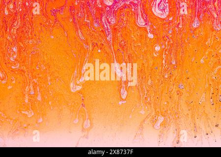 Colorful liquid mixture, blending paints in dynamic abstract fluid texture background, close up shot. Artistic, surreal and psychedelic design concept Stock Photo