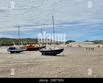 Boats on The sand at Traeth Abermaw Beach. Stock Photo