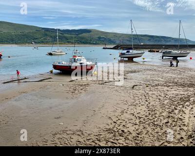 Boats on The sand at Traeth Abermaw Beach. Stock Photo