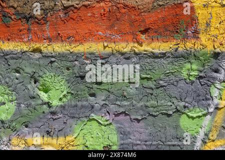 Mixed abstracts of different colors paint on old concrete wall background. Natural paintbrush strokes and textured rough cement. Stock Photo
