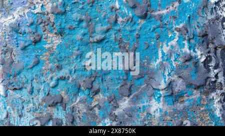 Old concrete wall with bright blue, with uneven texture. Stock Photo