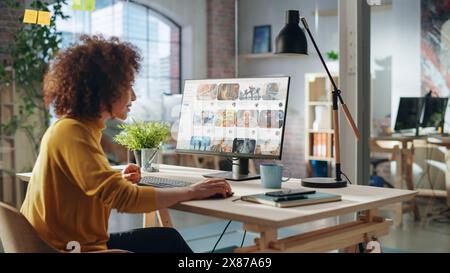 Middle Eastern Female Working in Creative Agency, Looking Through Social Media Trends for Marketing. Successful Specialist Using Computer with Video Streaming Platform Display Stock Photo