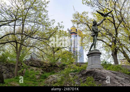 George Blackall Simonds' iron cast sculpture called 'The Falconer (1871)' is permanently situated on West 72nd Street inside Central Park. Stock Photo
