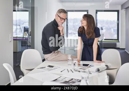 Two creative business colleagues working on a project in office Stock Photo