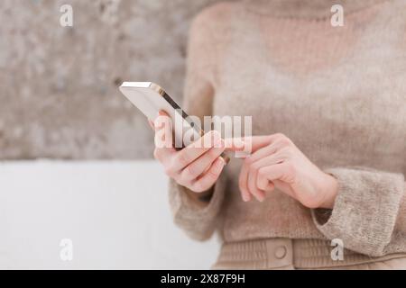 Hands of woman using smart phone Stock Photo