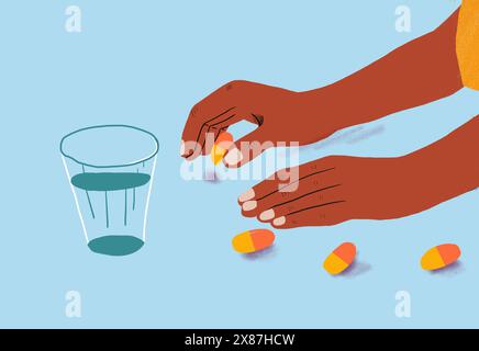 Hand reaching for pills by glass on blue background Stock Photo